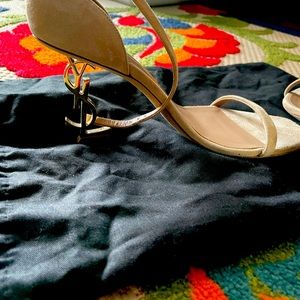 A soft suede finish contrasts the polished goldtone YSL-shaped heel. 36 1/2